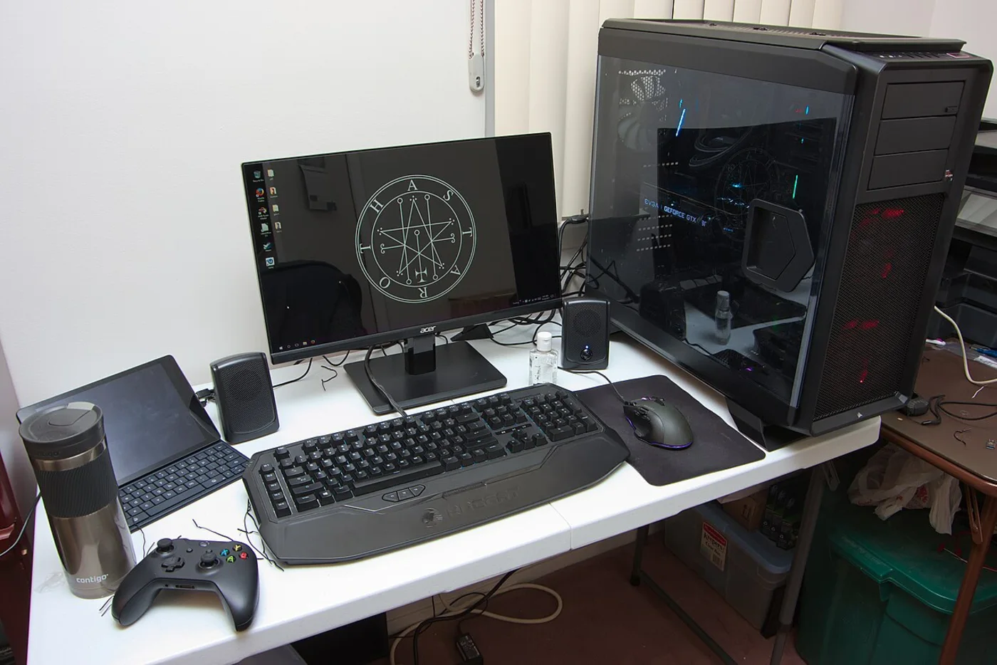 Complete high end gaming desk setup with tower, monitor and peripherals