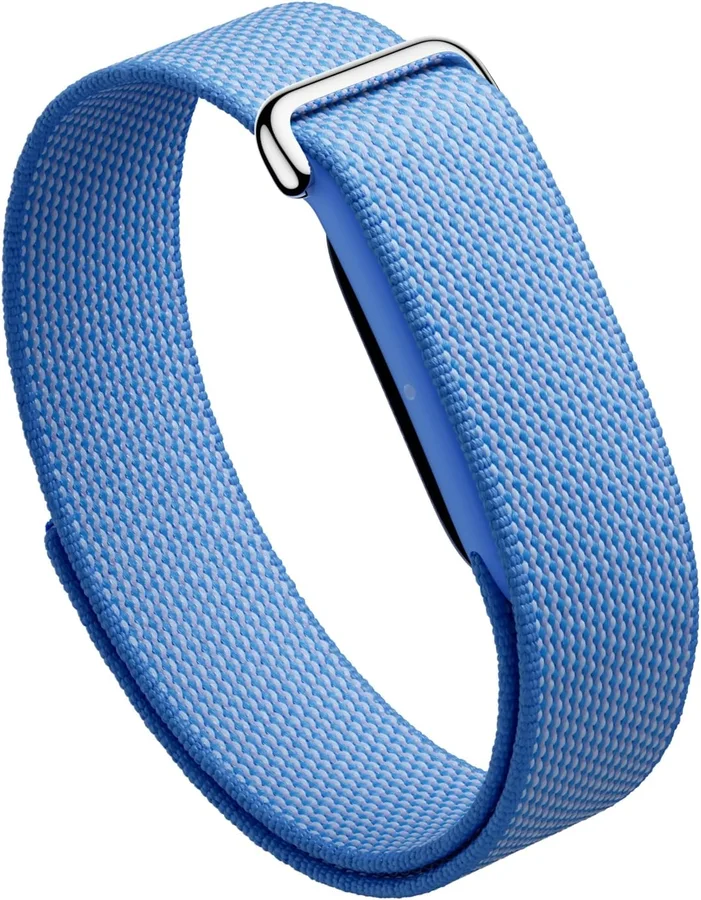 Google Fitbit Air screenless fitness tracker in the Lavender colourway, a light woven fabric band with a metal buckle